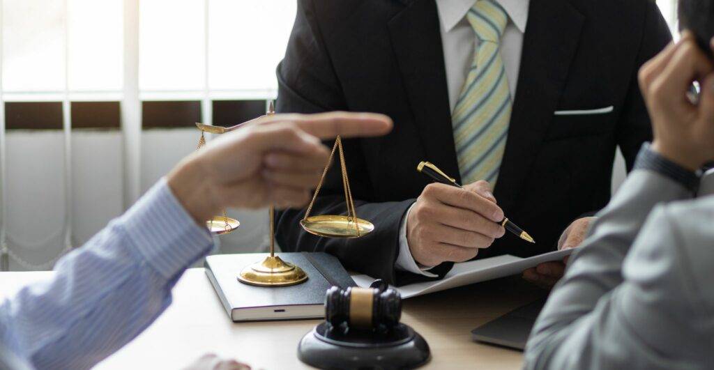 Solicitor facilitating contract dispute resolution between two parties